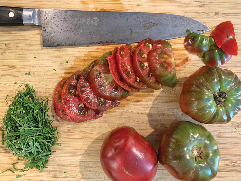 Grilled flank steak with heirloom tomatoes, arugula and mozzarella